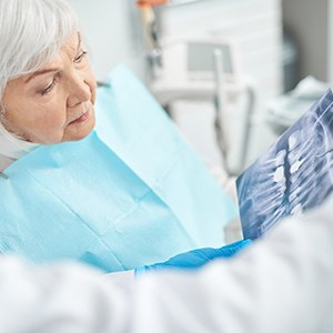 A woman consulting her dentist about dentures