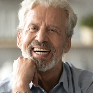 a man in Fairfax smiling with dentures