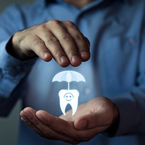 A tooth with an umbrella over it