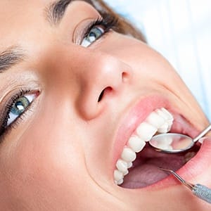 Woman receiving dental exam