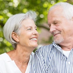 Senior man and woman smiling together