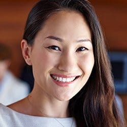 Woman with flawless smile after dental bonding