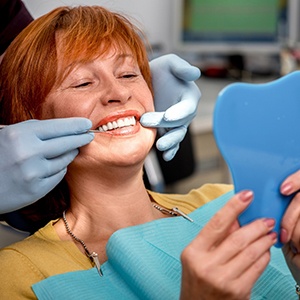 A senior woman getting dentures