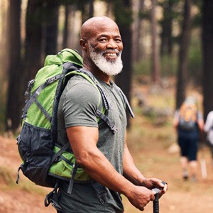 a man from Fairfax smiling with new dentures