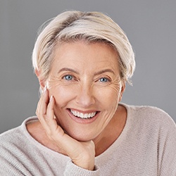 a patient smiling after gum recontouring