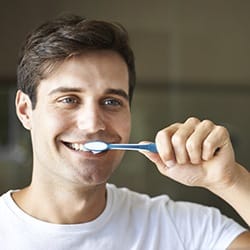 Man brushing teeth