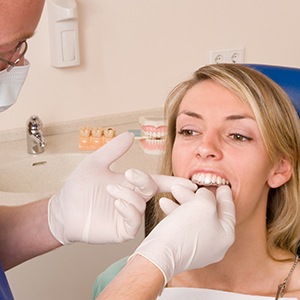 Invisalign dentist in Fairfax helping a patient