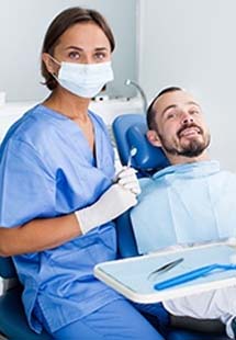 A male patient prepares for a dental checkup near the Mosaic District, VA