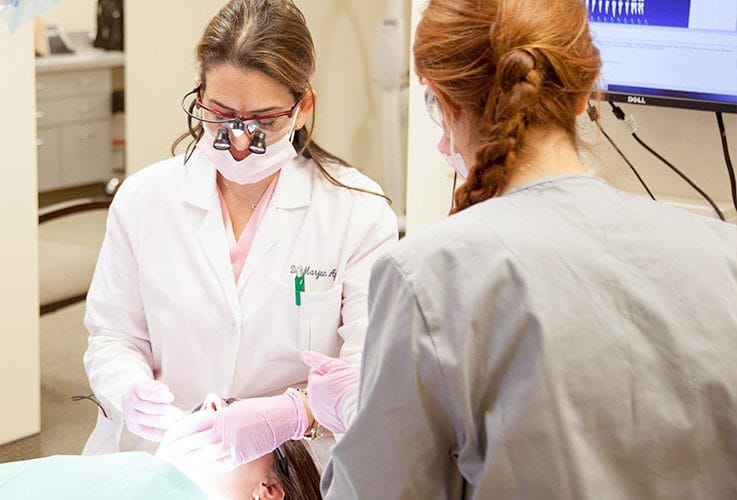 Dr. Ayati treating dental patient