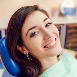 Smiling woman in dental chair