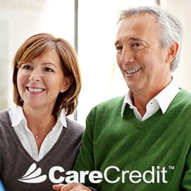 Older man and woman smiling together