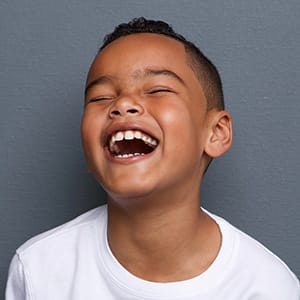 Laughing little boy after children's dentistry visit