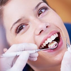 Smiling woman during dental exam