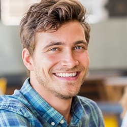 Smiling young man after oral cancer screening