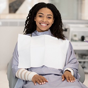 Smiling patient, happy she could afford root canal therapy