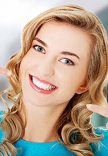 Woman with flawless smile after restorative dentistry