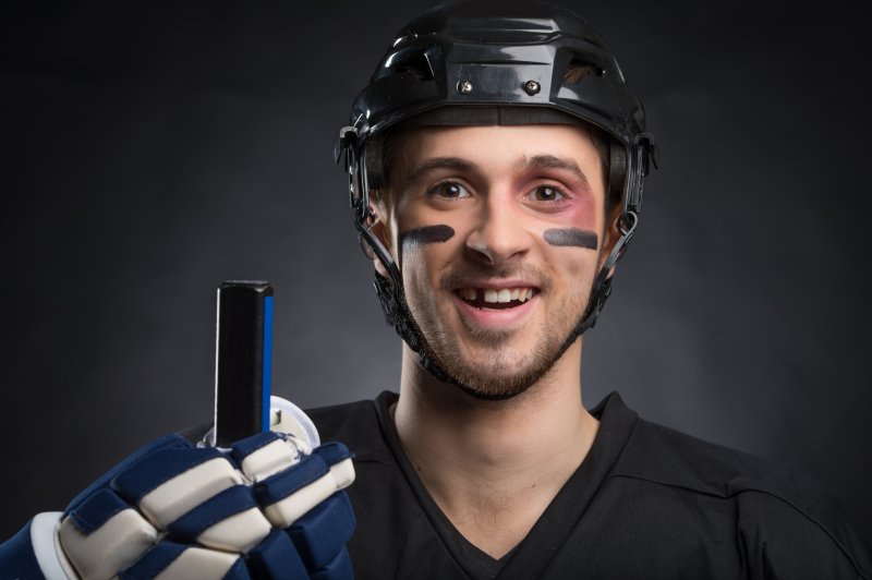 Hockey player with knocked-out tooth