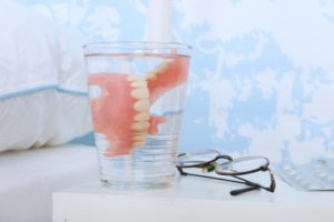 Closeup of dentures in Fairfax in water