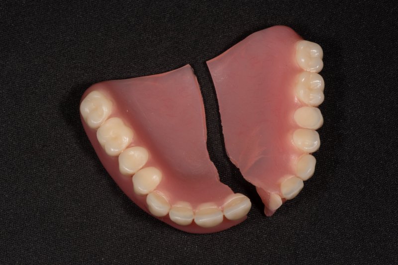A set of dentures that have been split in half