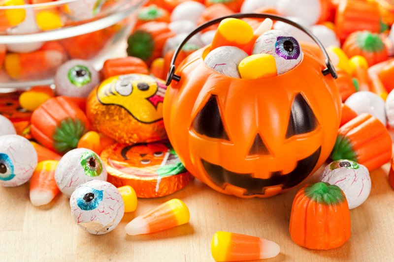 An overflowing bucket of Halloween candy you can eat with Invisalign